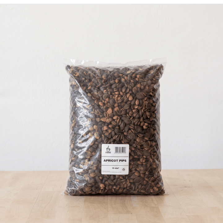 A bag of Apricot Pips, a natural soil topper for pots, providing moisture retention and a neat finish.
