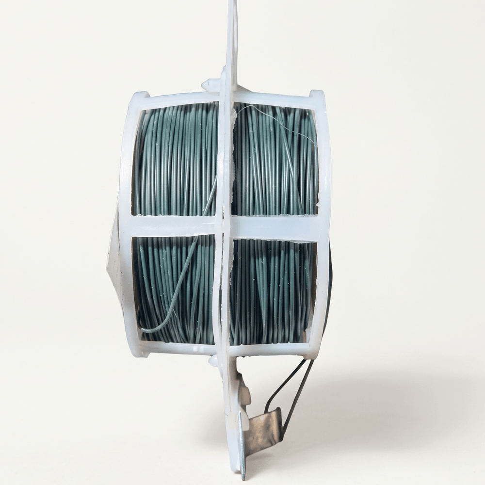 Binding Wire on a spool, ideal for securing plants to stakes and trellises with its flexible and easy-to-shape design.
