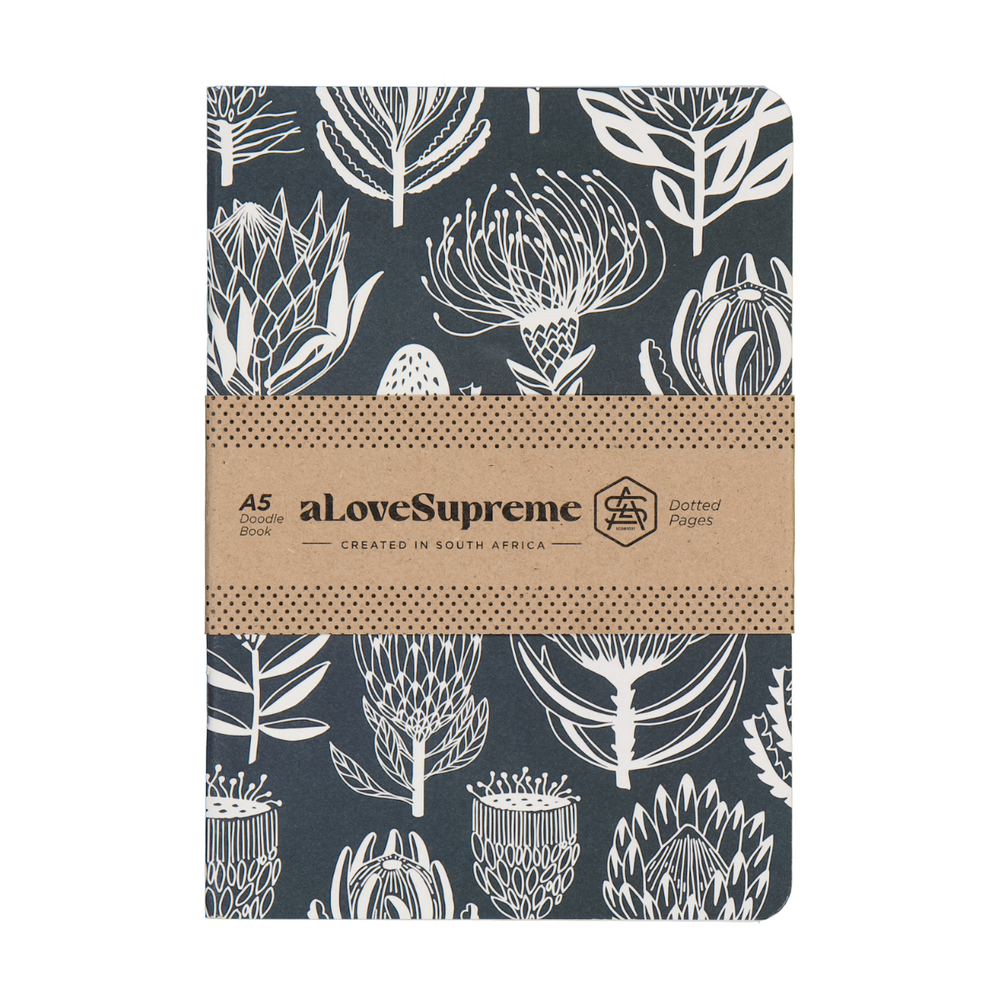 Notebook with floral pattern and brown band featuring 'alovesupreme' branding on a white background