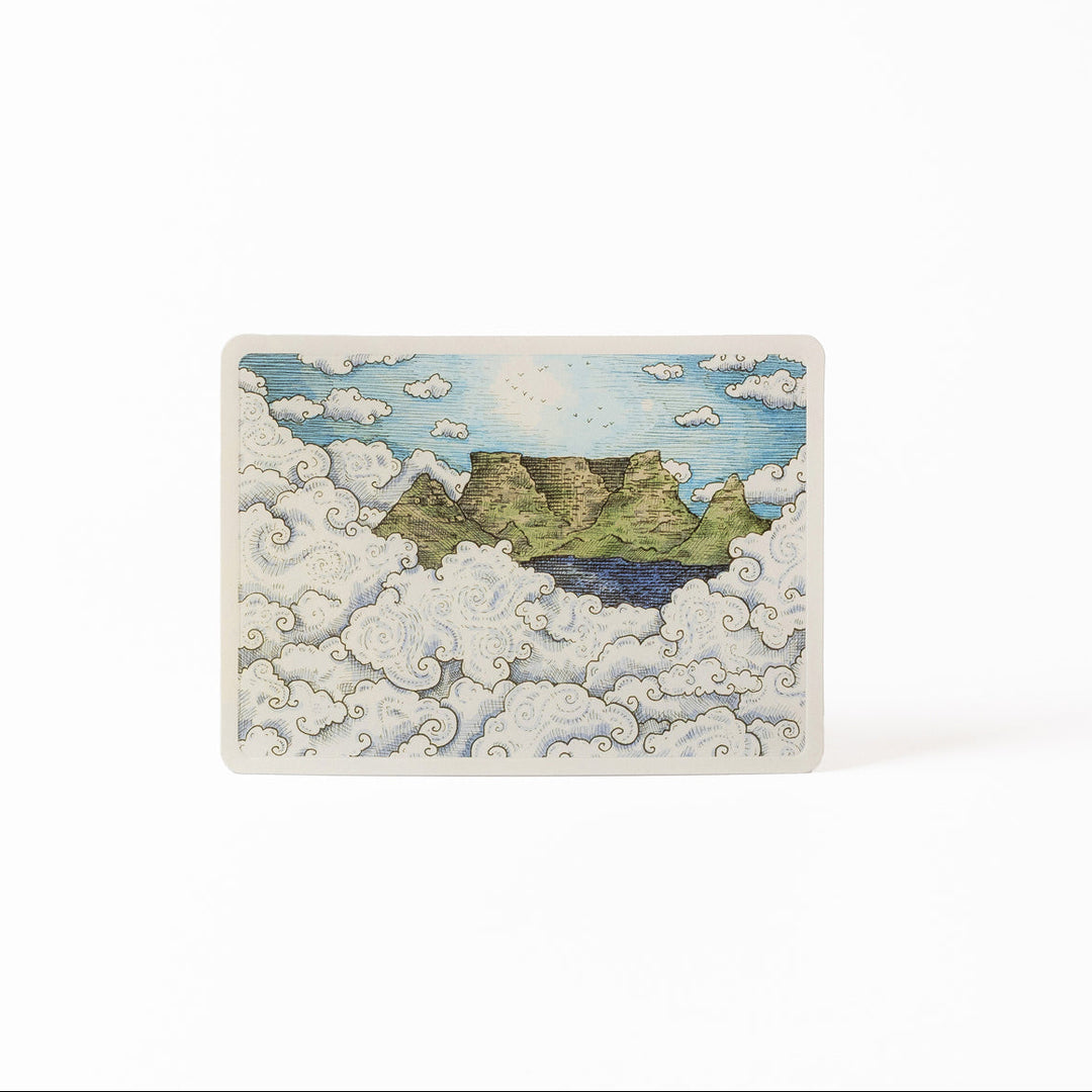 Small rectangular card with a scenic illustration of Table Mountain, partially hidden by clouds.