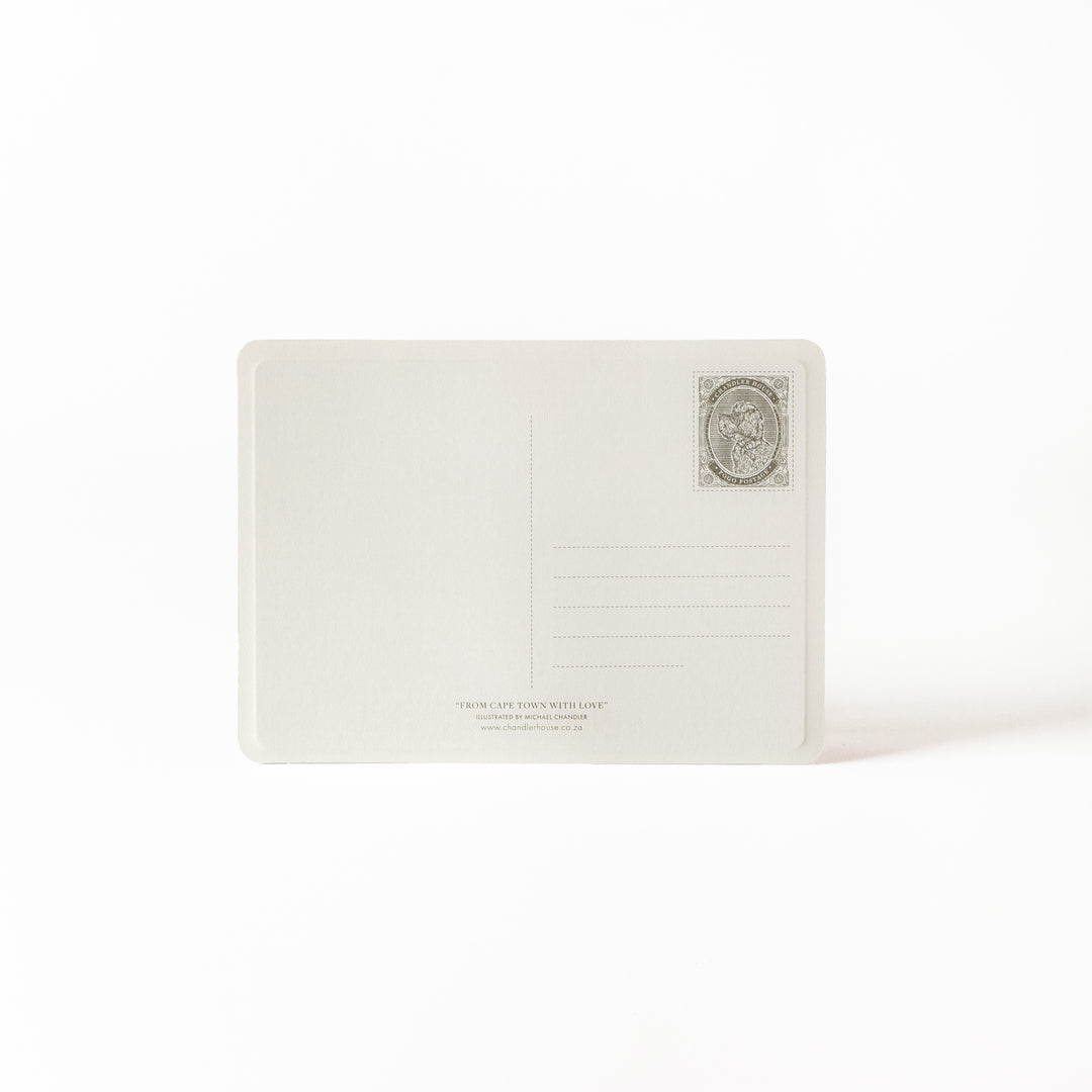 Traditional postcard backing with a decorative emblem 