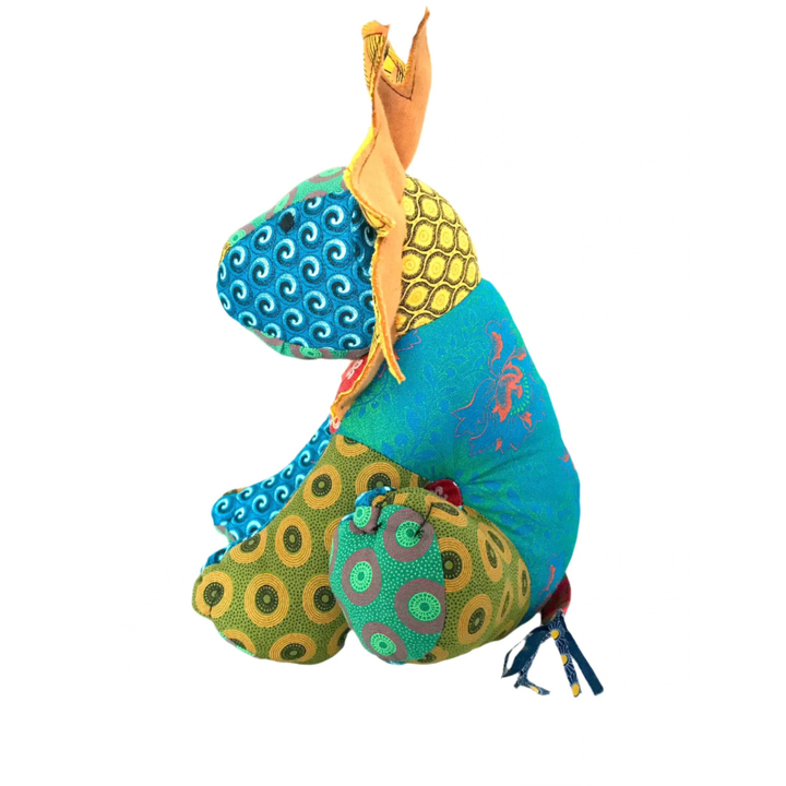 One side of Lion Shweshwe Stuffed Toy, with colourful fabric on white background