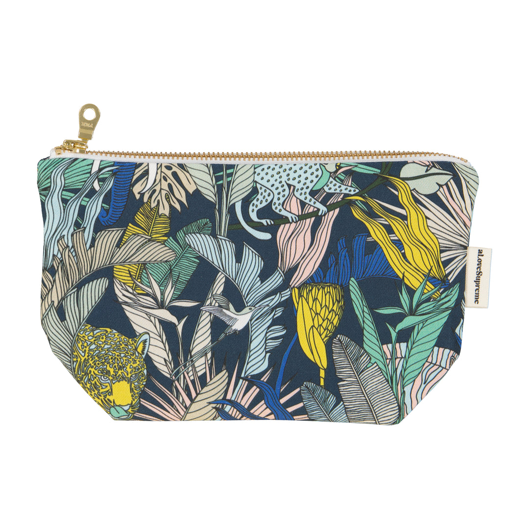 Cosmetic bag with tropical leaf pattern on a white background