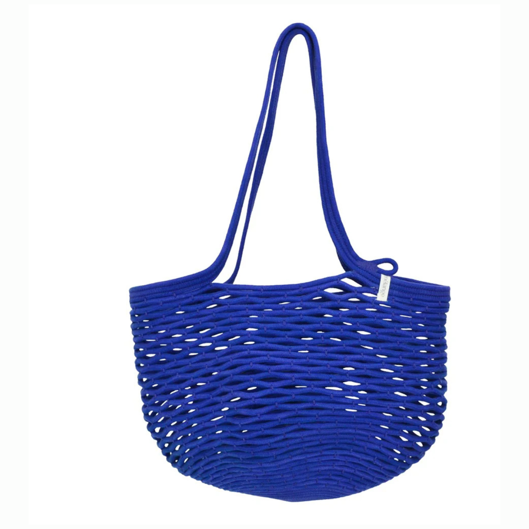 Blue woven handbag on a white background