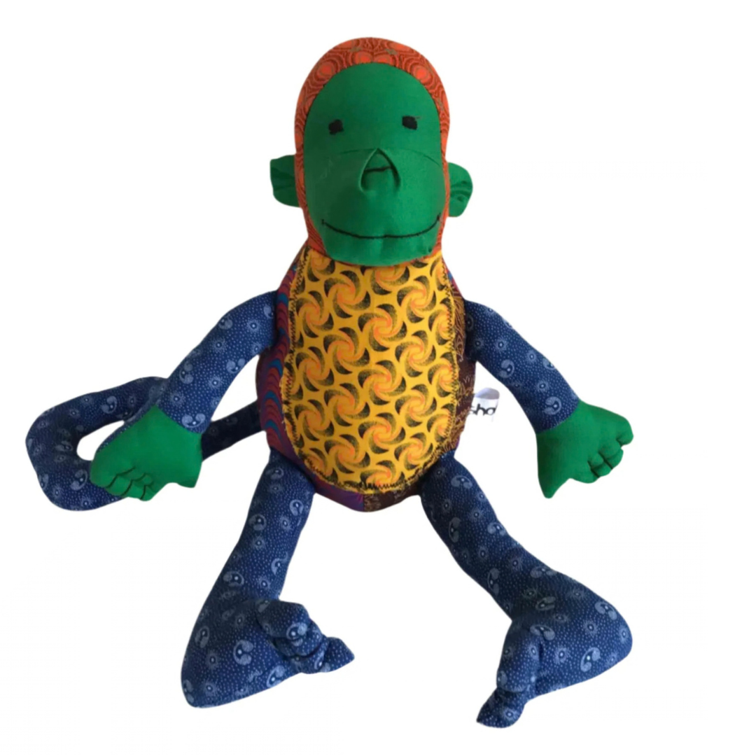 Front of Monkey Shweshwe Stuffed Toy, with colourful fabric on white background
