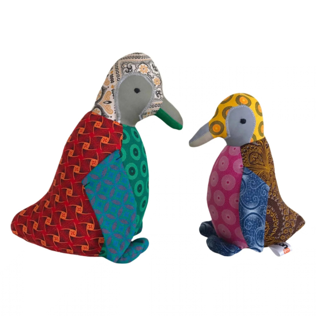 Two Penguine Shweshwe Stuffed Toy, with colourful fabric on white background