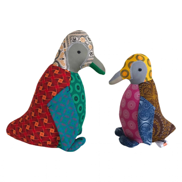 Two Penguine Shweshwe Stuffed Toy, with colourful fabric on white background
