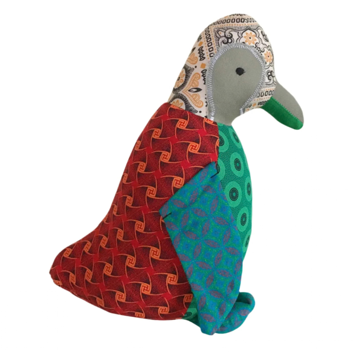 Side  of Penguine Shweshwe Stuffed Toy, with colourful fabric on white background
