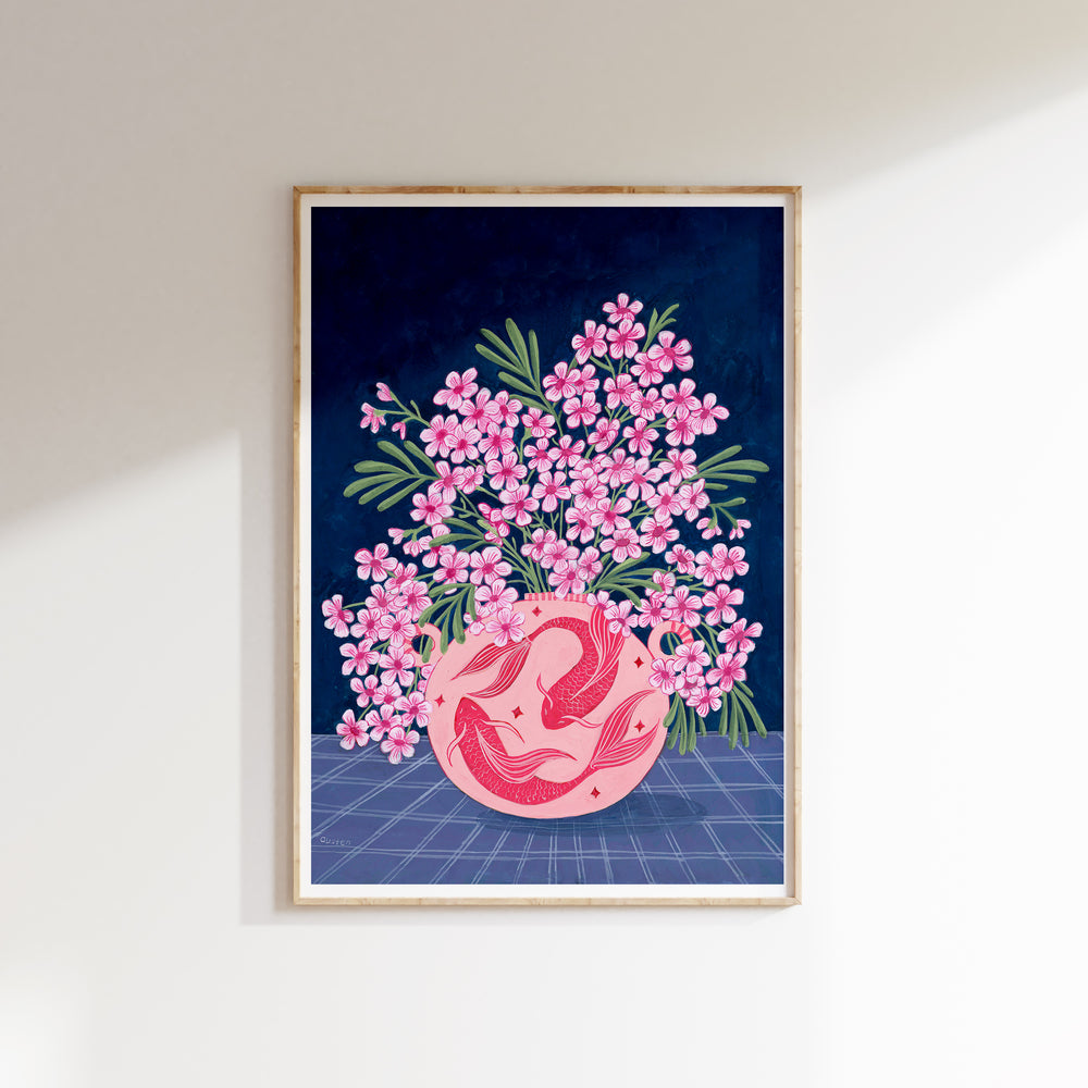 Framed artwork with pink floral design and abstract elements on a blue grid background.