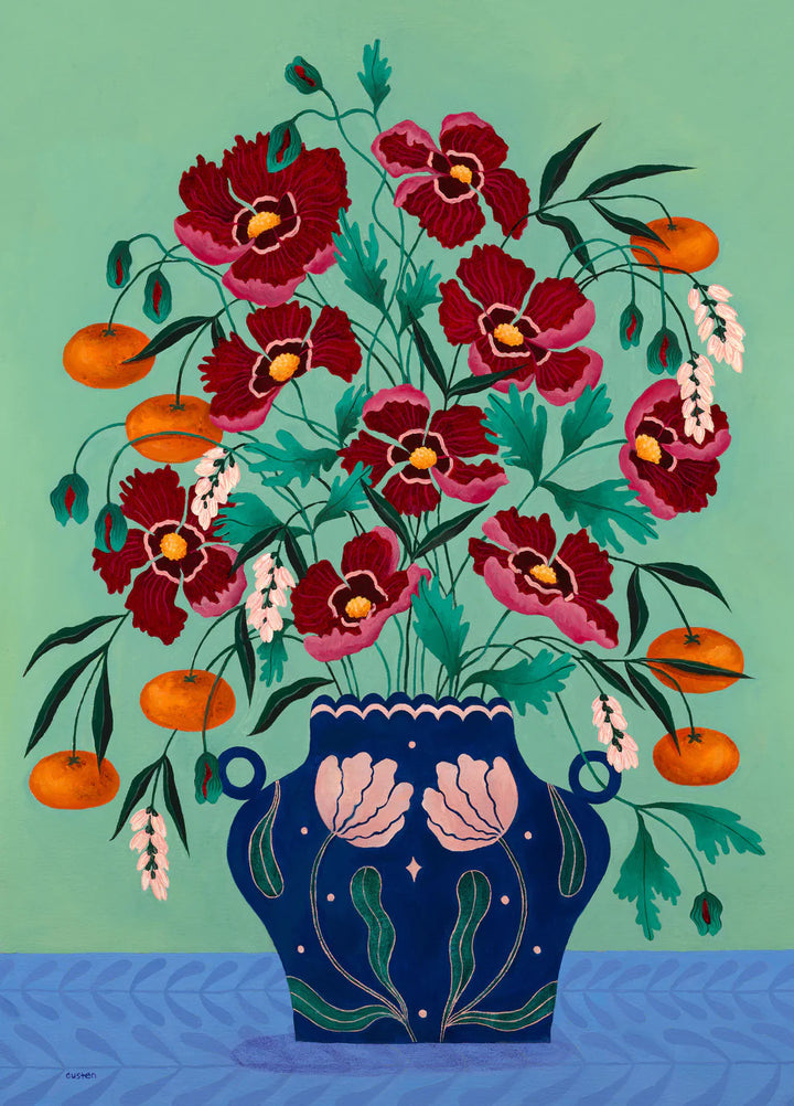 Fine art print of a bright red floral display in a deep blue vase with light pink floral motif.