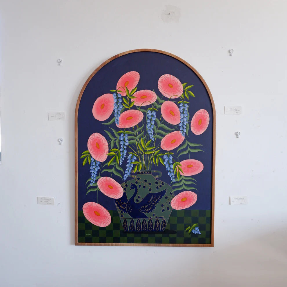 Arch Framed fine art print of a bright pink floral display in a sage vase with a deep blue swan motif.